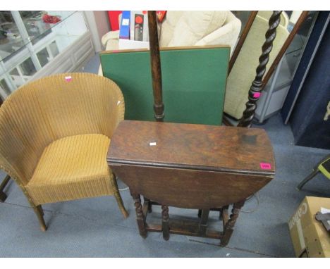 A selection of furniture to include an oak barley twist gate leg table, two standard lamps with shades, one being a barley tw