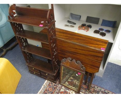 An Edwardian mahogany gate leg table, a Georgian mahogany mirror and a reproduction mahogany bookcase