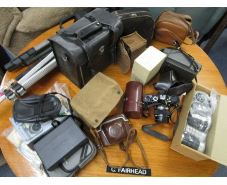 A large selection of vintage cameras, lens and accessories to include Zeiss Ikon Cortina J camera in a leather case, an Olymp