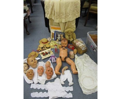 Vintage dolls' component parts to include nine dolls' heads, an early Victorian child's cape, teddy bear books,  Heinz collec