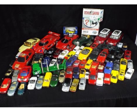 Bburago, Corgi, Maisto and Others. In excess of 50 predominately unboxed diecast and plastic model vehicles in various scales