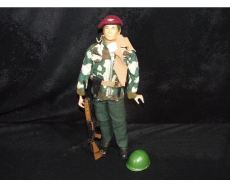 Palitoy - An unboxed Palitoy Talking Commander Action Man Figure in Paratrooper Uniform. The figure is a brown flock hair har