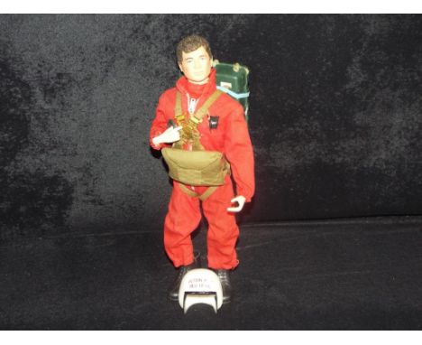 Palitoy - An unboxed Palitoy Action Man figure in Red Devil Parachutist Uniform. The figure is a brown flock hair hard hands 