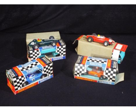 Scalextric - Four boxed vintage Scalextric racing cars. Lot includes C90 Ferrari; C89 BRM and similar. Models appear to be in