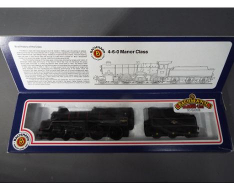 Bachmann - A boxed OO gauge Manor Class 4-6-2 steam locomotive and tender Op.no. 75020 in black BR livery. The model appears 