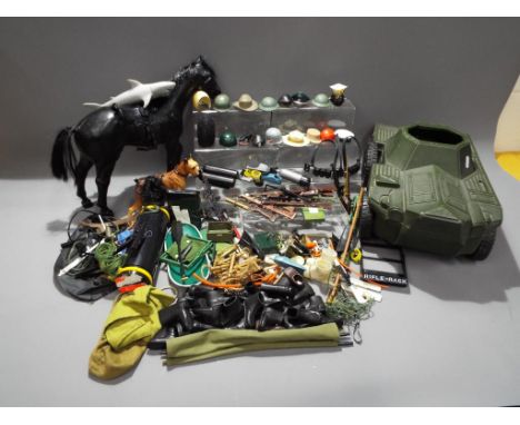 Palitoy - A large quantity of Action Man accessories by Palitoy. Lot includes helmets, rifles, boots, tools, and weapons. Als