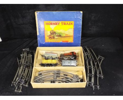 Model Railways - a boxed Hornby Dublo clockwork 0-4-4 goods train set in LMS livery, items in playworn condition in a poor bo
