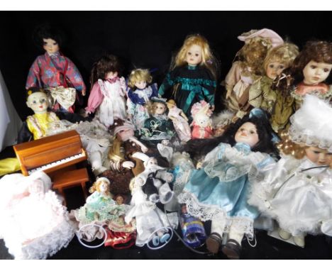 A quantity of porcelain and ceramic dolls (in excess of 25) in various condition, also included in the lot is a doll house pi