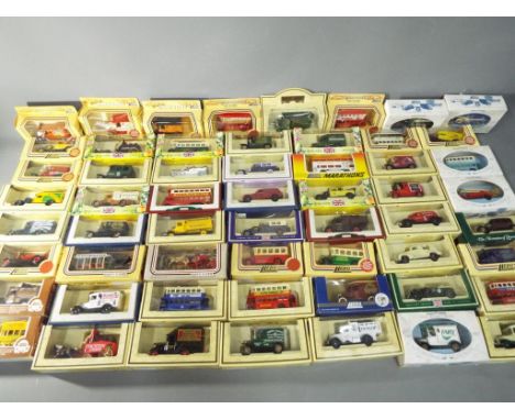 Lledo - a collection of 57 diecast model vans and cars in various scales, all appear in mint condition in original boxes This