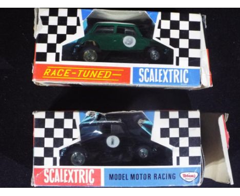 Scalextric - Two boxed vintage Scalextric cars. Lot consists of C7 Rally Mini Cooper - Green and C7 Rally Mini Cooper - Black