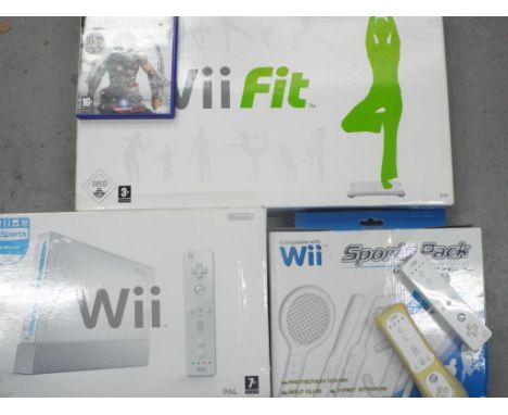 Nintendo Wii - a games console Nintendo Wii Fit Board and Sports pack, also included in the lot some controllers and a Playst