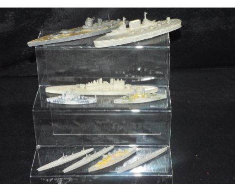 Chad Valley and Similar Manufacturers - An armada of 9 Waterline Warships in approx 1/1200th scale. The lot contains a Chad V