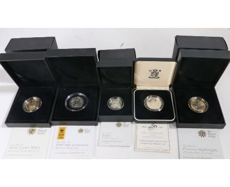 Five Royal Mint cased silver proof coins, 2010 Belfast £1, 50th anniversary of the United Nations piedfort £2, 2011 WWF 50th 