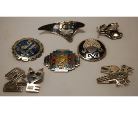 A collection of silver and enamel set brooches, to include Peruvian examples (7)