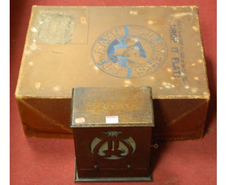An early 20th century oak cased cigarette dispenser in the form of a gramophone speaker together with a Player's Navy Cut car
