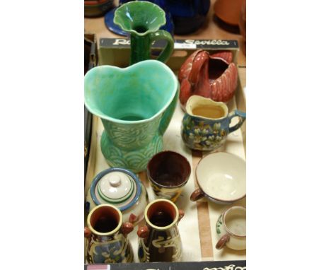 An early 20th century Watcombe pottery red glazed swan vase; together with a large early 20th century Aller Vale green glazed