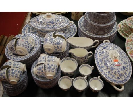 An extensive Minton tea and dinner service in the Shalamar pattern, to include; graduated meat plates, dinner plates, tureens