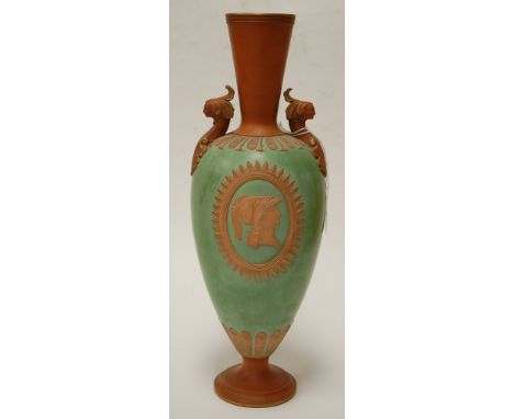 A Watcombe pottery terracotta pedestal vase, of ovoid form, the green glazed body with relief portrait plaque of a soldier wi