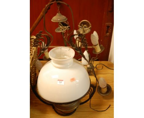 A Victorian brass hanging oil lamp within wrought iron frame, having opalescent glass shade; together with a pair of brass fi