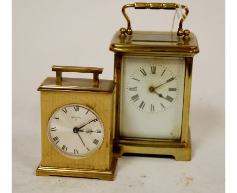 An early 20th century lacquered brass carriage clock, having white enamel dial with Roman numerals and visible platform lever