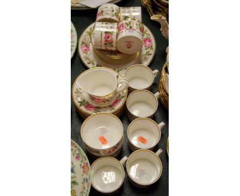 A Royal Worcester part tea and dinner service in the Royal Garden pattern 