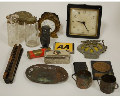 A collection of miscellaneous items to include a novelty pewter pepperette in the form of an owl, various AA car badges, mant