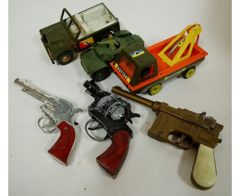 A Triang tinplate tow-truck; together with a plastic model of an army tank; and a Triang model of a open topped Land Rover et