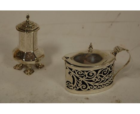 An Edwardian pierced silver mustard, having blue glass liner and associated spoon by William Hutton & Sons of Birmingham; tog