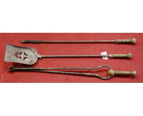 A set of three Victorian steel and turned brass fire tools