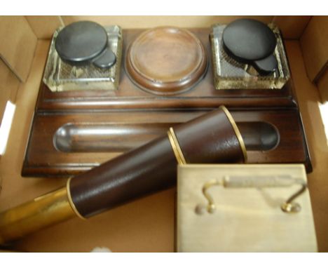 An early 20th century walnut deskstand, having twin glass inkwells; together with a brass and leather clad three-drawer pocke