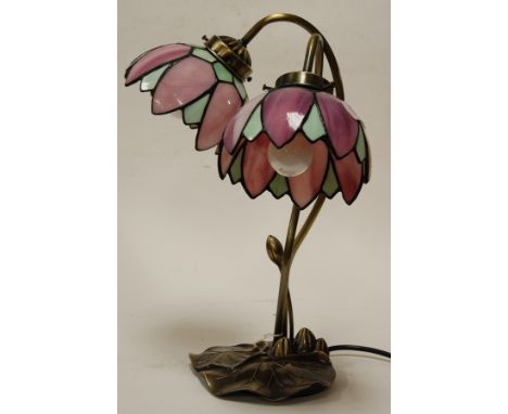 A modern Art Nouveau style twin branch table lamp each with leaded glazed shade