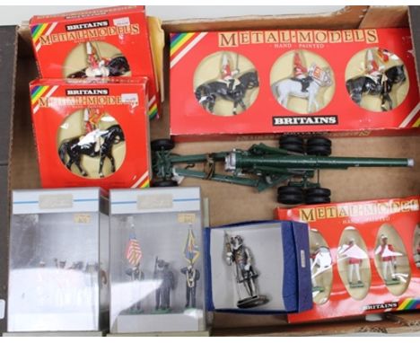 A BRITAINS DIE-CAST MODEL OF A FIELD GUN mounted on three axle trailer, together with Britains hand-painted metal models moun
