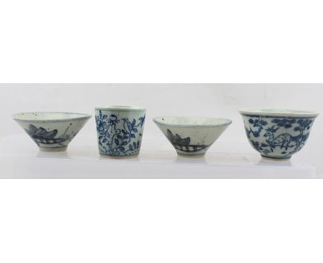 FOUR CHINESE CHING DYNASTY GLAZED CERAMIC CUPS, includes a pair of flared form, 8.3cm diameter, each with cobalt blue painted