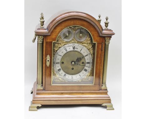 A GEORGIAN DESIGN TWIN FUSEE BRACKET CLOCK, having dome topped mahogany case with brass columns and finials, side carrying ha