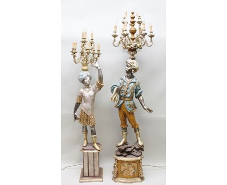 TWO 20TH CENTURY BLACKAMOOR STANDARD LAMPS, having carved wood gesso and polychrome with gilding, the tallest standing upon a