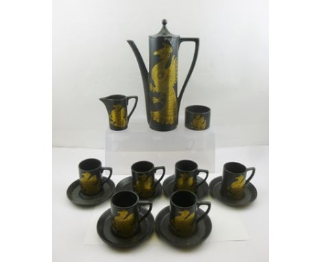 A PORTMEIRION POTTERY "PHOENIX" PATTERN COFFEE SERVICE, having ebonised ground with gilded decoration, designed by John Cuffl