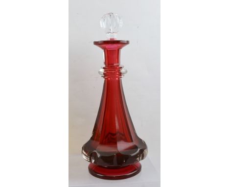 A 19TH CENTURY CRANBERRY GLASS DECANTER of tapering facet form with clear glass stopper, overall 29cm high 