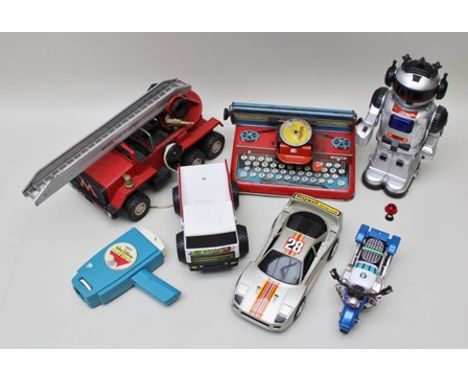 A MOGUL FIRE FIGHTER TIN-PLATE FIRE ENGINE with extending ladder, Mettype Junior tin-plate typewriter, a Mettoy Walt Disney m