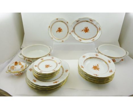 A HEREND PART DINNER SERVICE decorated in "Chinese Bouquet" pattern with rust orange and gilded design, based on an early pat