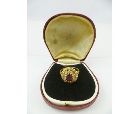 A RUBY AND DIAMOND CLUSTER RING, set in 18ct gold, ring size M 1/2 