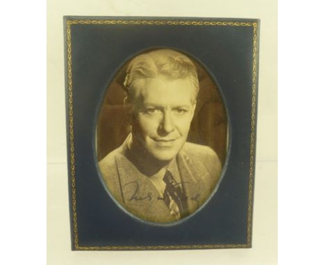 NELSON EDDY (1901-1967) A black and white studio portrait, autographed, oval mounted in easel photo frame, 10cm x 7.5cm 