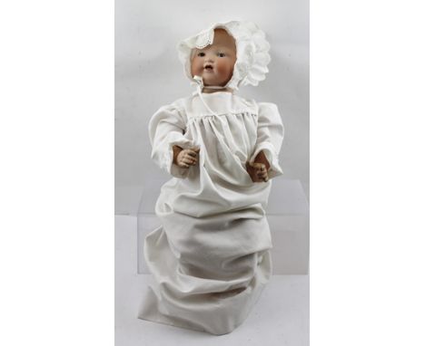 AN ARMAND MARSEILLE BISQUE HEADED DOLL, having closing eyes, composition body, verso of neck inscribed 'A M German 351/6K', 5