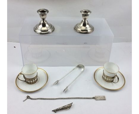 A PAIR OF WALKER AND HALL SILVER GILT COFFEE CAN HOLDERS, Birmingham 1926, with Shelley ceramic liners and saucers, white wit