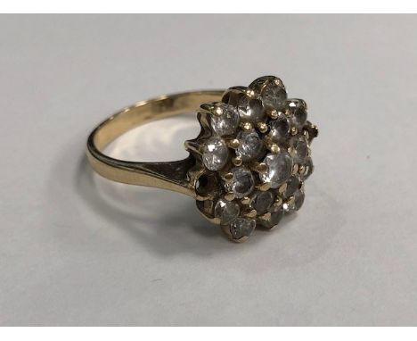 WHITE GEM SET CLUSTER RING set with round white brilliant cut gems,in nine carat gold, size R, 5.4g