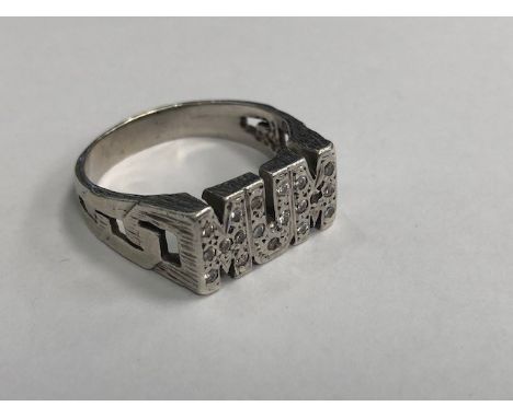 GEM SET MUM RING, set with round white gems, 9mm wide, on textured curb link effect shoulders, unmarked, size R, 6.4g