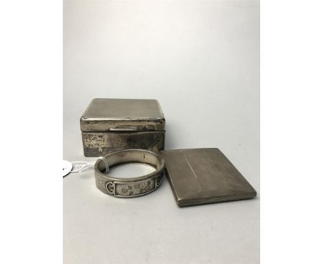 GEORGE V SILVER CIGARETTE BOX, with Birmingham hallmarks; along with a silver cigarette case, silver napkin ring and a silver