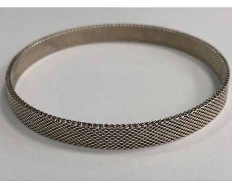 SILVER MESH BANGLE STAMPED T&Co, 61mm inner diameter, marked T&Co 925 to the interior, 12.7g