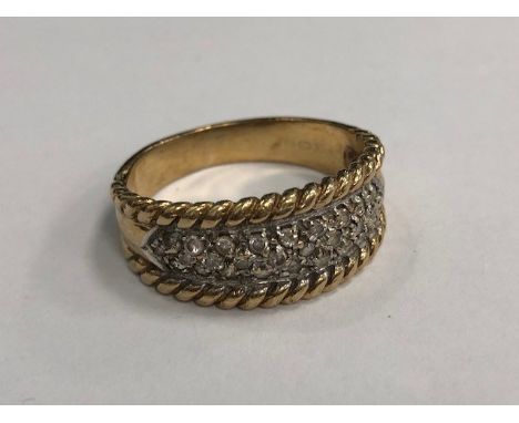 GEM SET BAND, of tapered form, with a panel of grain set white gems, unmarked, size R, 5g