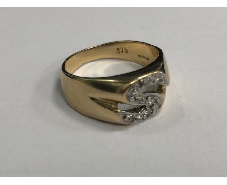 GEM SET INITIAL RING, in the form of the letter S, with round white gems, in nine carat gold, size K 1/2, 3.6g
