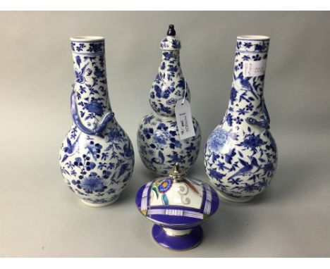 PAIR OF EARLY 20TH CENTURY CHINESE BLUE AND WHITE VASES, with salamanders in relief to the necks and with floral designs, fou